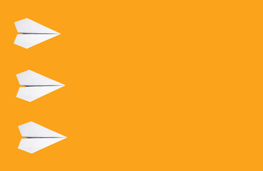 Banner with white origami planes on orange background. Paper folding art. Copy space. High quality...