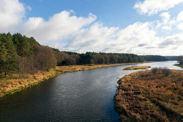 a wide river in the autumn season