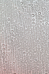 a large number of bubbles and water droplets on the surface
