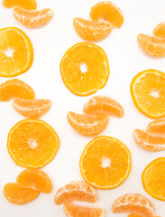 slice Tangerine or orange with leaf design isolated on white background,top view