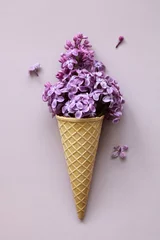 Keuken spatwand met foto purple lilac in a waffle cone for ice cream. © MaskaRad
