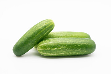 green cucumber over on white background.