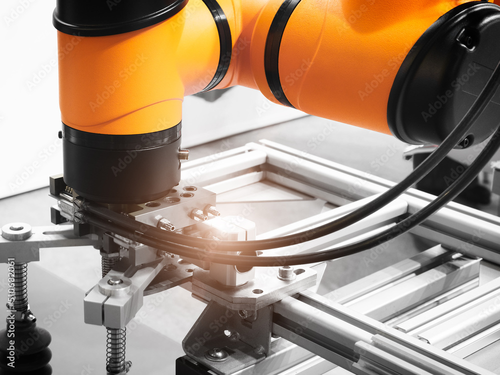 Poster Modern robotic industrial technology concept, Automated CNC machine loading with robotic arm. Selective focus.