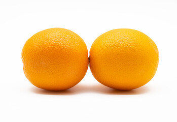 Fresh whole orange fruit isolated on white background.