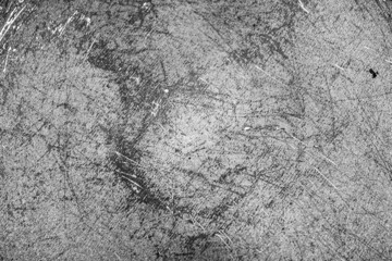 Grunge black texture. The texture of the scratches on the metal. Texture scratches background monochrome. Rough textured hard background. The surface is damaged.