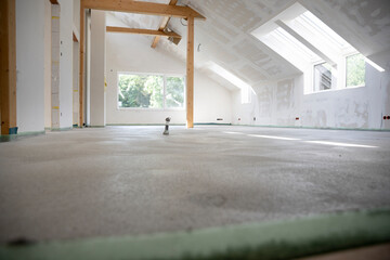 freshly cured concrete screed on construction site in loft in a family house