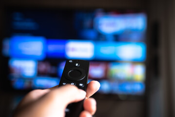 Rio de Janeiro / Brazil- February 3, 2021: amazon fire tv stick remote in hand with selective focus...