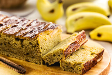 long banana cake made with organic banana, cinnamon and oatmeal, sliced. Brazilian homemade cake