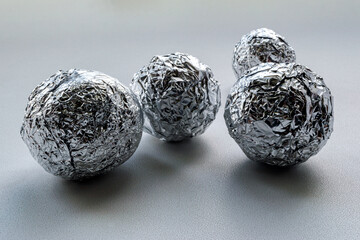 a few crumpled round foil balls