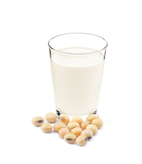 Glass of soy milk with soybeans isolated on white background.