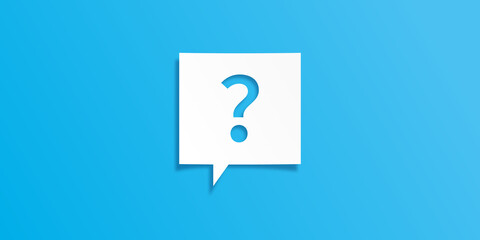 吹き出し型の紙に切り抜かれたクエスチョンマーク