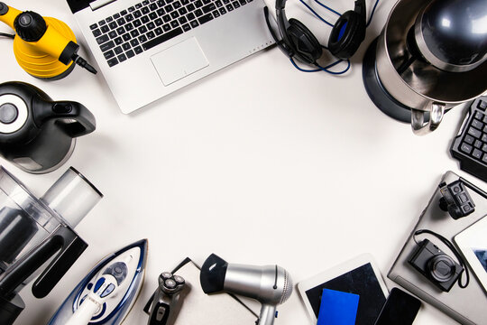 Old computers, digital tablets, mobile phones, many used electronic gadgets devices, broken household and electric appliances. Top view. Planned obsolescence, electronic waste for recycling concept