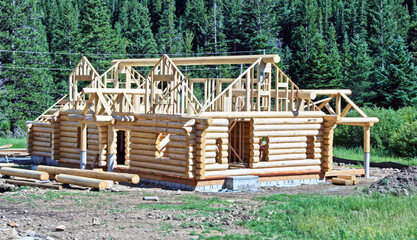 Modern log cabin under construction in the Colorado mountains