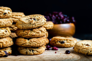 delicious dried cookies made of high-quality flour with dried red cranberries on the table