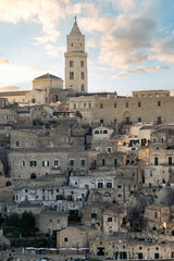 Fototapeta premium Stunning view of the Matera’s skyline during a beautiful sunset. Matera is a city on a rocky outcrop in the region of Basilicata, in southern Italy