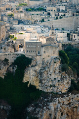 Fototapeta na wymiar Stunning view of the Matera’s skyline during a beautiful sunset. Matera is a city on a rocky outcrop in the region of Basilicata, in southern Italy