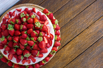 vanilla coconut cheesecake, decorated with fresh strawberries, a cup of aroma coffee on a table