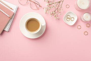 Business concept. Top view photo of workplace candles diaries pencils cup of coffee on saucer...