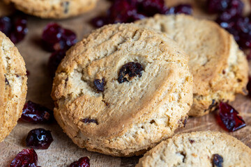 delicious dried cookies made of high-quality flour with dried red cranberries on the table