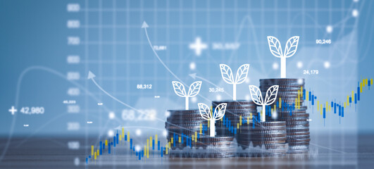 Close up of stacking of growth up coins with Double exposure of chart graph financial with night...