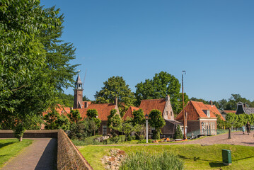Fototapeta na wymiar Enkhuizen, Netherlands, June 2022. The traditional fishermen's houses at the Zuiderzee Museum in Enkhuizen.