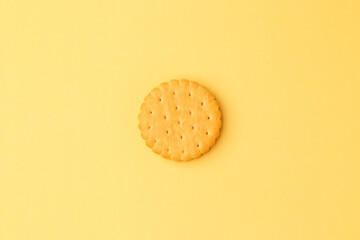 Minimalism. Cookies with fruit filling on a yellow background. Light background. Close-up. View from above. A place to copy.