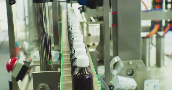 closed plastic bottles move along the conveyor.close-up.