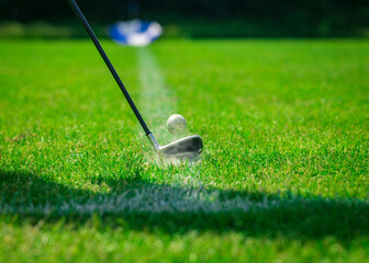Playing golf. Golf course. Golf ball and club.