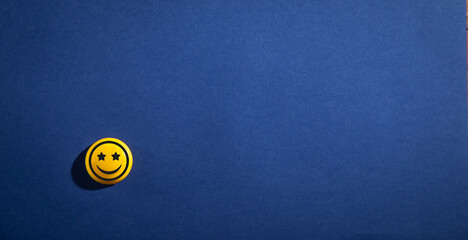 Smiley face on the blue background. Experience. Satisfaction