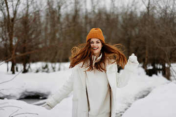 cheerful woman red hair walk in the fresh winter air There is a lot of snow around