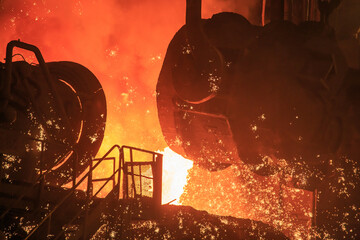 Casting ladle in steel mill workshop.