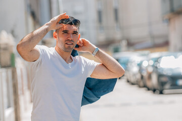 attractive adult man in summer on the street