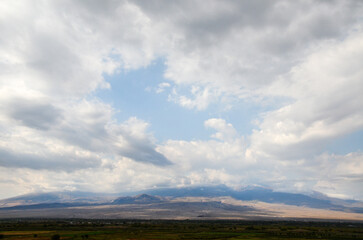 The panoramic view of mount Ararat hidden by clouds which rises above the Ararat valley and...