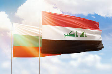 Sunny blue sky and flags of iraq and bulgaria