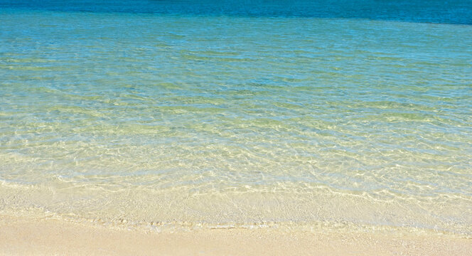 Sea water and sand beach at summer.