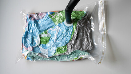 Getting air out of a vacuum bag - obrazy, fototapety, plakaty