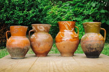 Fototapeta na wymiar Set of clay jug outdoor view