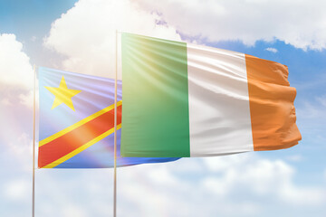 Sunny blue sky and flags of ireland and dr congo