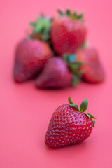 Strawberries on red