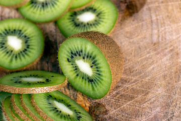 sliced green kiwi on a cutting board