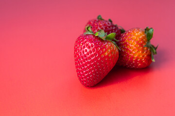 Strawberries on red