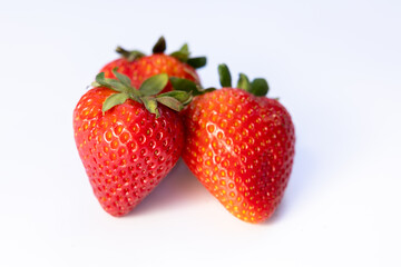 Three strawberries on white
