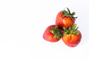 Three strawberries on white