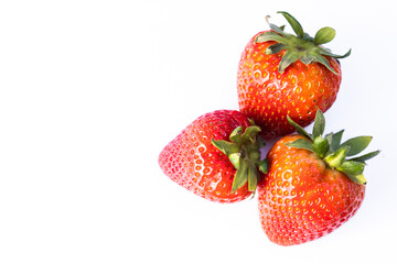 Three strawberries on white