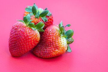 Strawberries on red