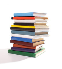 stack of different books isolated on white background