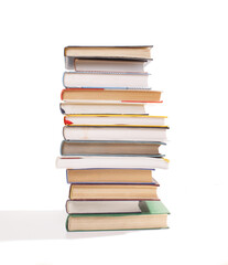 stack of different books isolated on white background