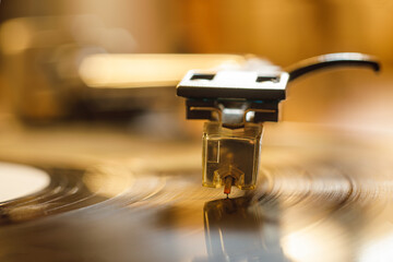 turntable stylus playing music record from vinyl disc, macro photo