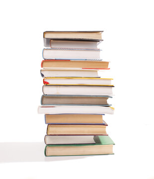 stack of different books isolated on white background