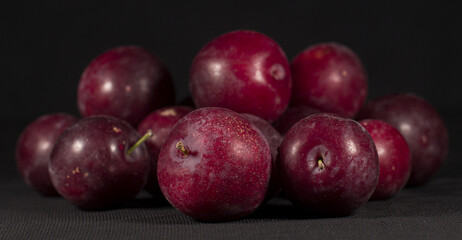 plums with black background